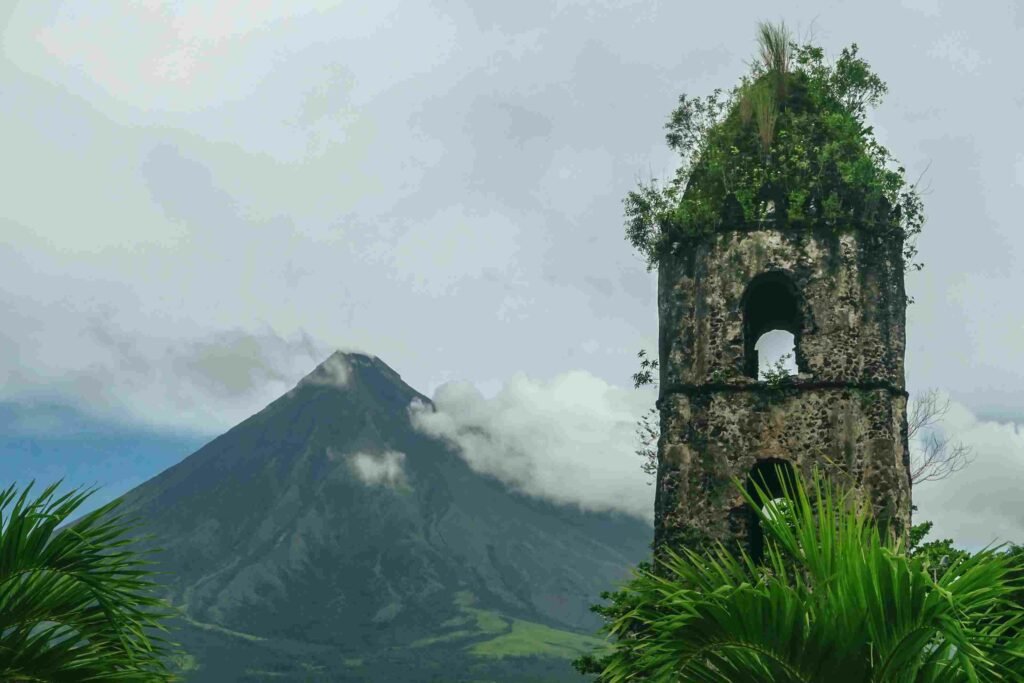 The bell tower at the Cagsawa Ruins with the Mayon Volcano in the background