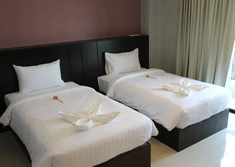 Twin beds at The Proud Exclusive Hotel